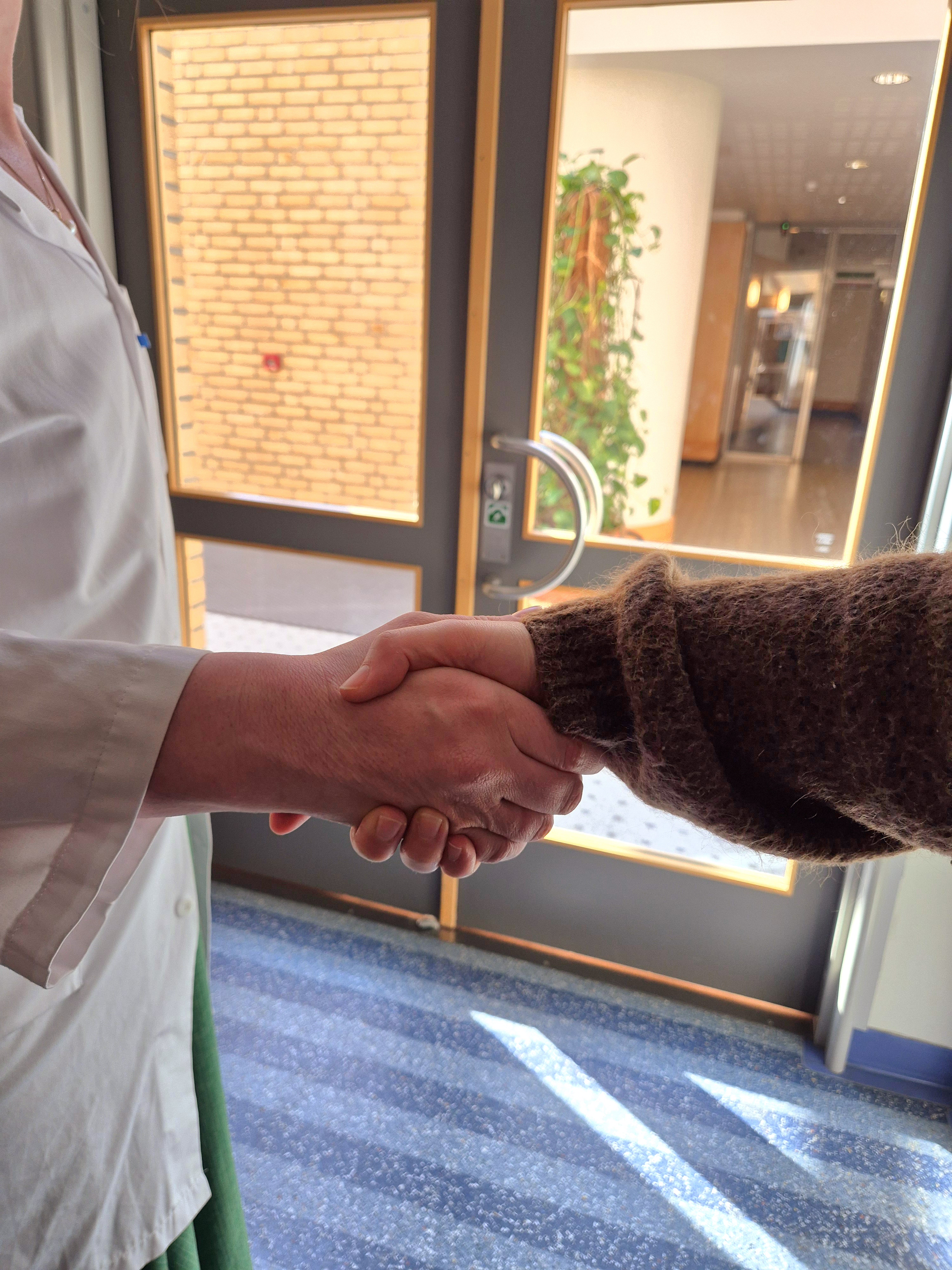 A person's hand on a table