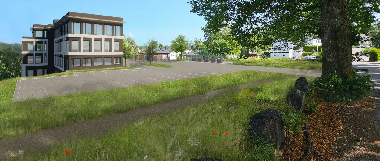 En bygning med parkeringsplass, skissetegning