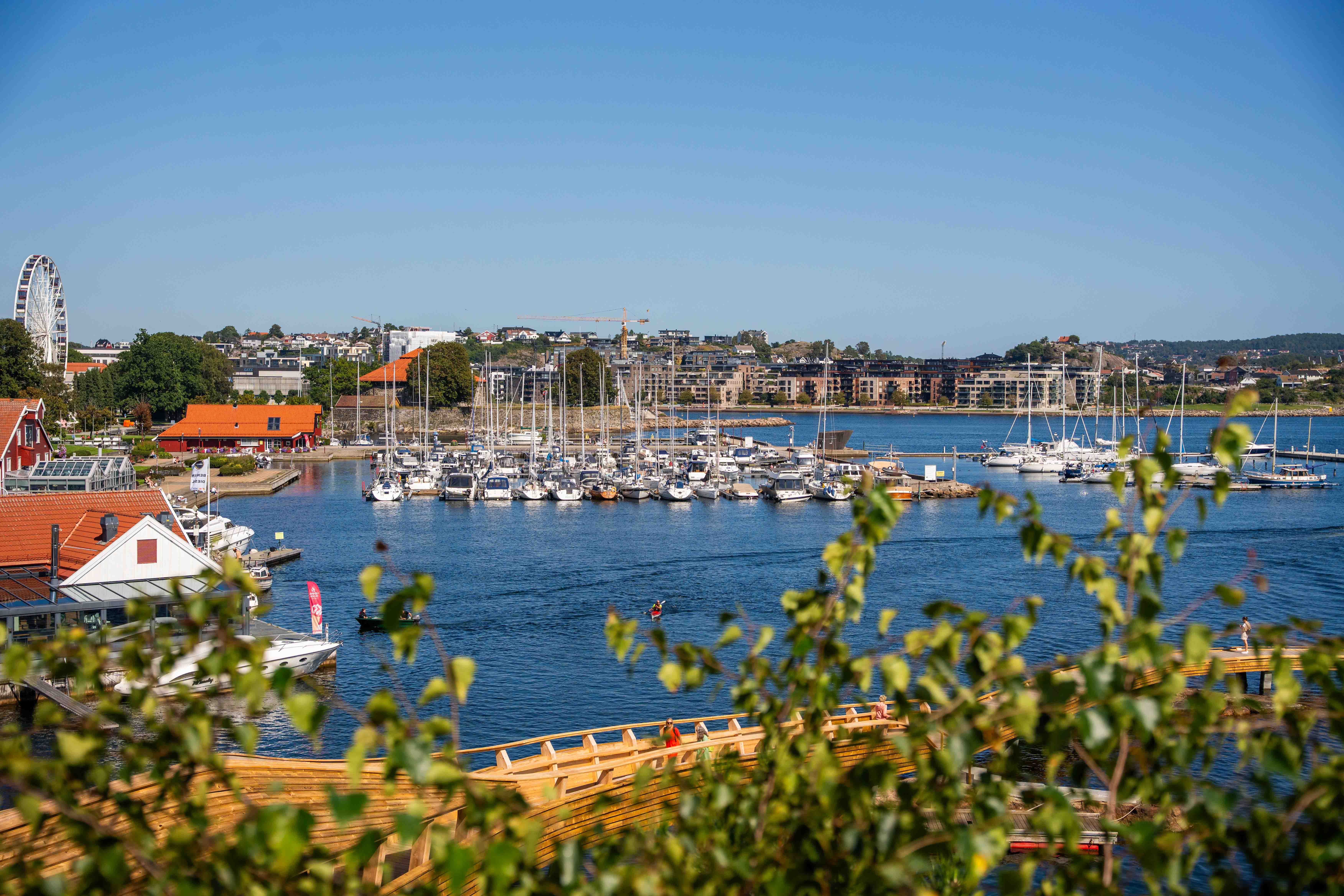 A body of water with boats in it and buildings around it
