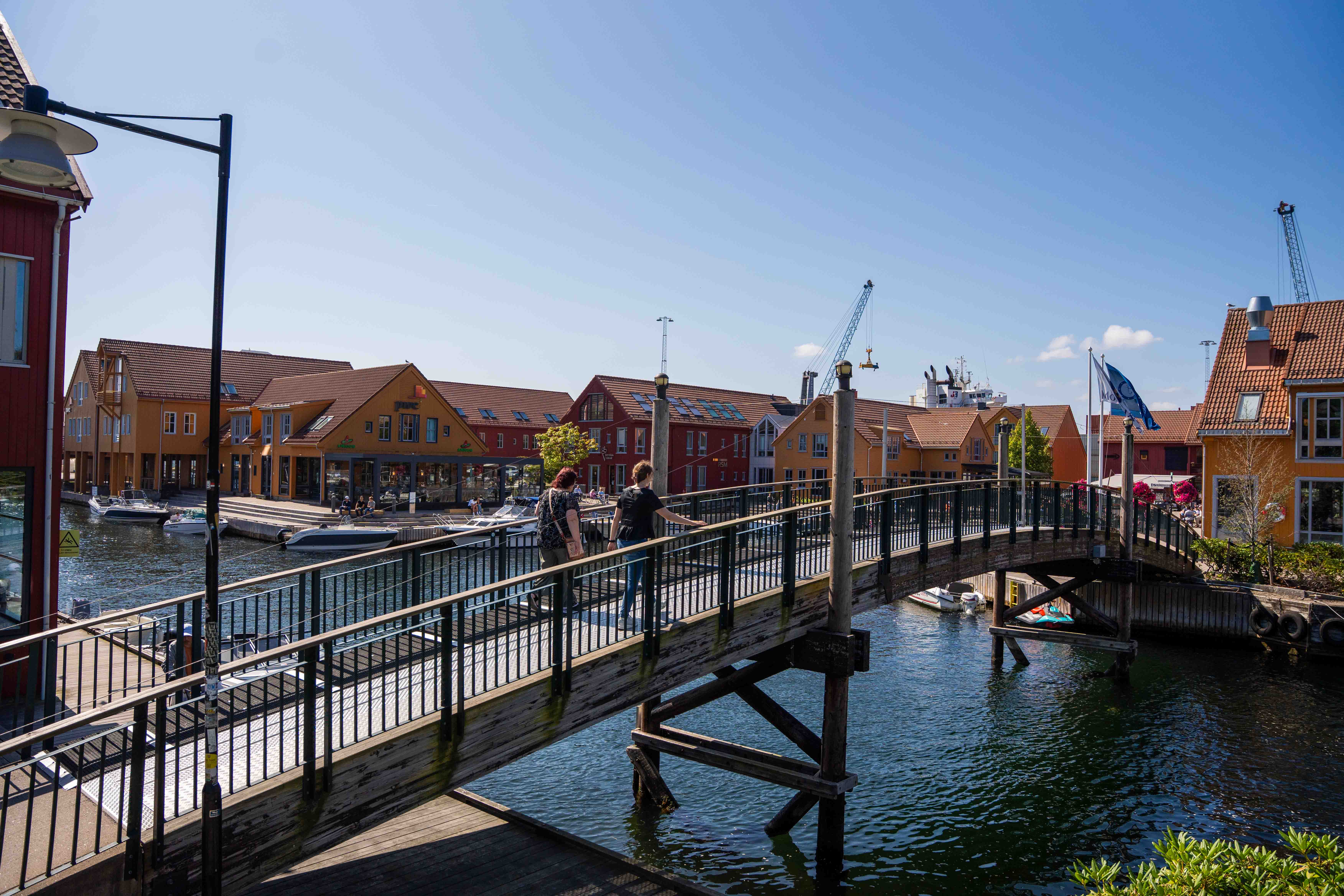 A bridge over a body of water with buildings on the side
